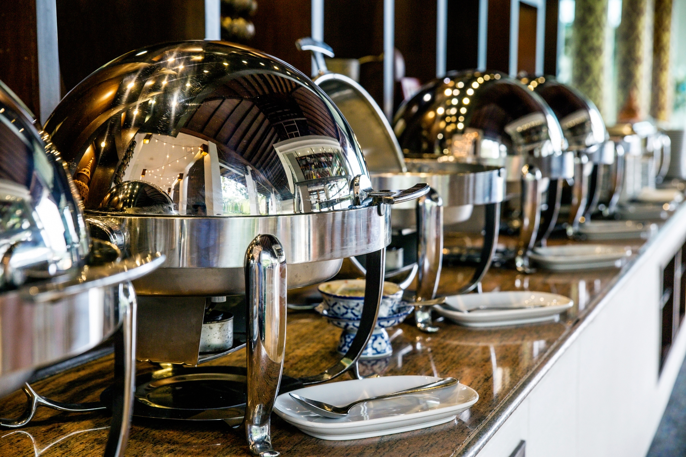 Catering buffet food with heated trays ready for service